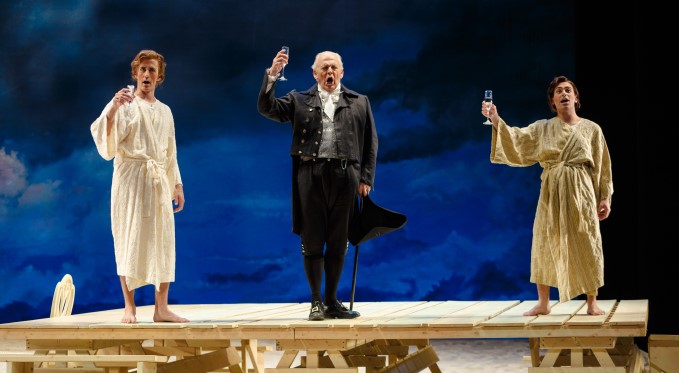 Guglielmo, Don Alfonso and Ferrando toast to their wager. Photo: David Bachman Photography