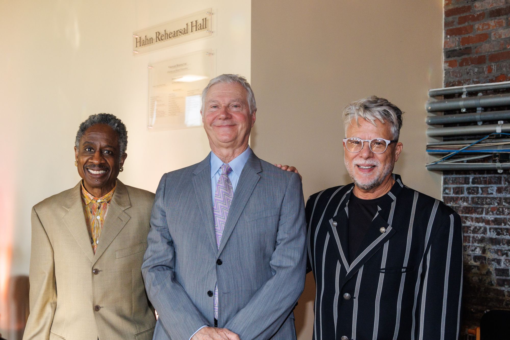 Photo of Christopher Hahn, center, in the newly-renamed Hahn Rehearsal Hall, with Izear Winfrey, left, and Ron Booth, by David Bachman.
