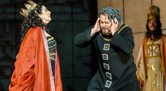 Abigaille (Csilla Boross) sends Nabucco (Mark Delavan) back to prison after denying his request for clemency for his daughter Fenena. 