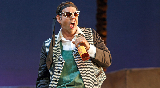 Nemorino (Dimitri Pittas) has some newfound swagger after consuming some Elixir of Love, which unbeknownst to him is cheap red wine. Photo By: David Bachman