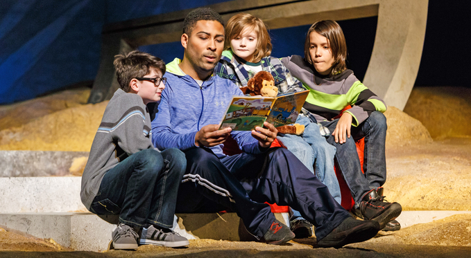 Brian (Ben Taylor) tries to read his boys Virgil, Martin, and Samuel (Simon Nigam, Harrison Salvi, River Beckas) a bedtime story.