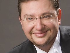 A headshot of Antony Walker