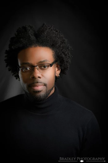 A headshot of Darius Gillard